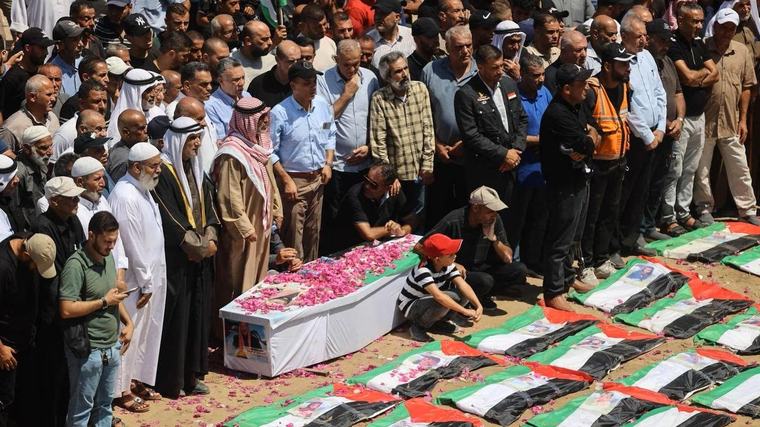 Remains of 70 children among 100 Palestinians laid to rest in mass Gaza funeral